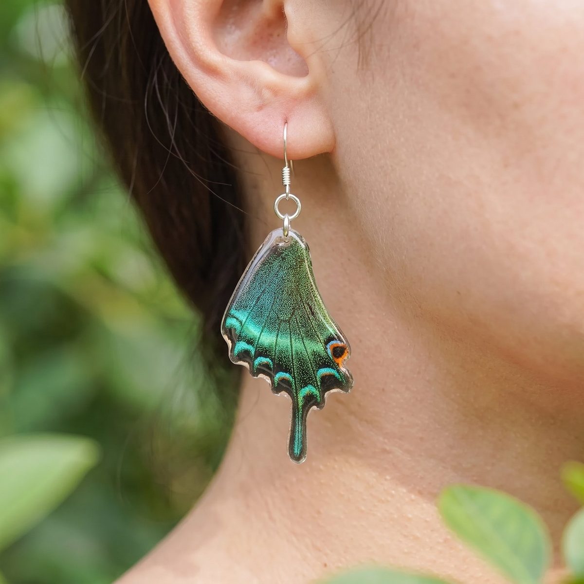 Emerald Swallowtail Wing Dangle Earrings on model