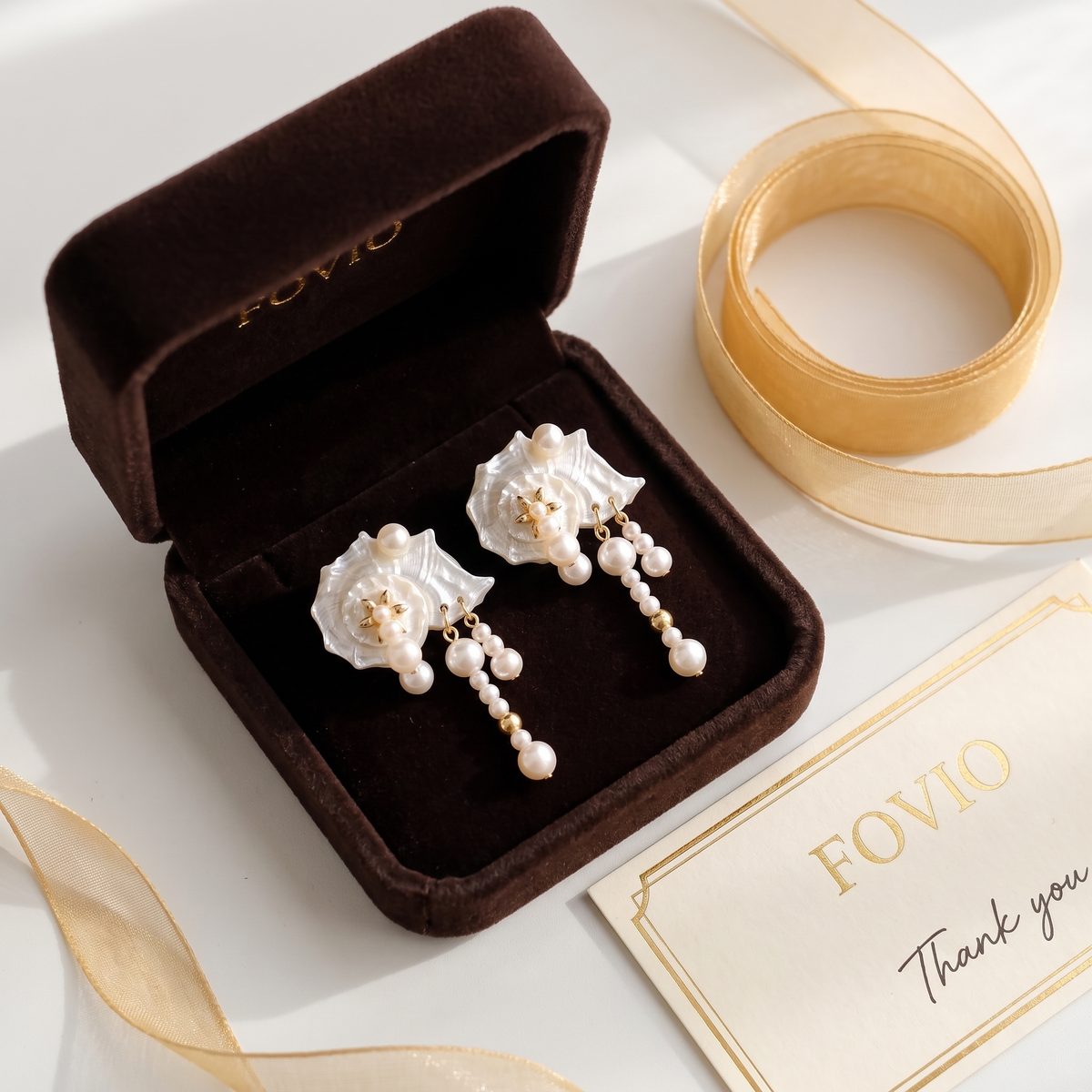 Hand-inspected Mother of Pearl earrings in FOVIO presentation box with care note