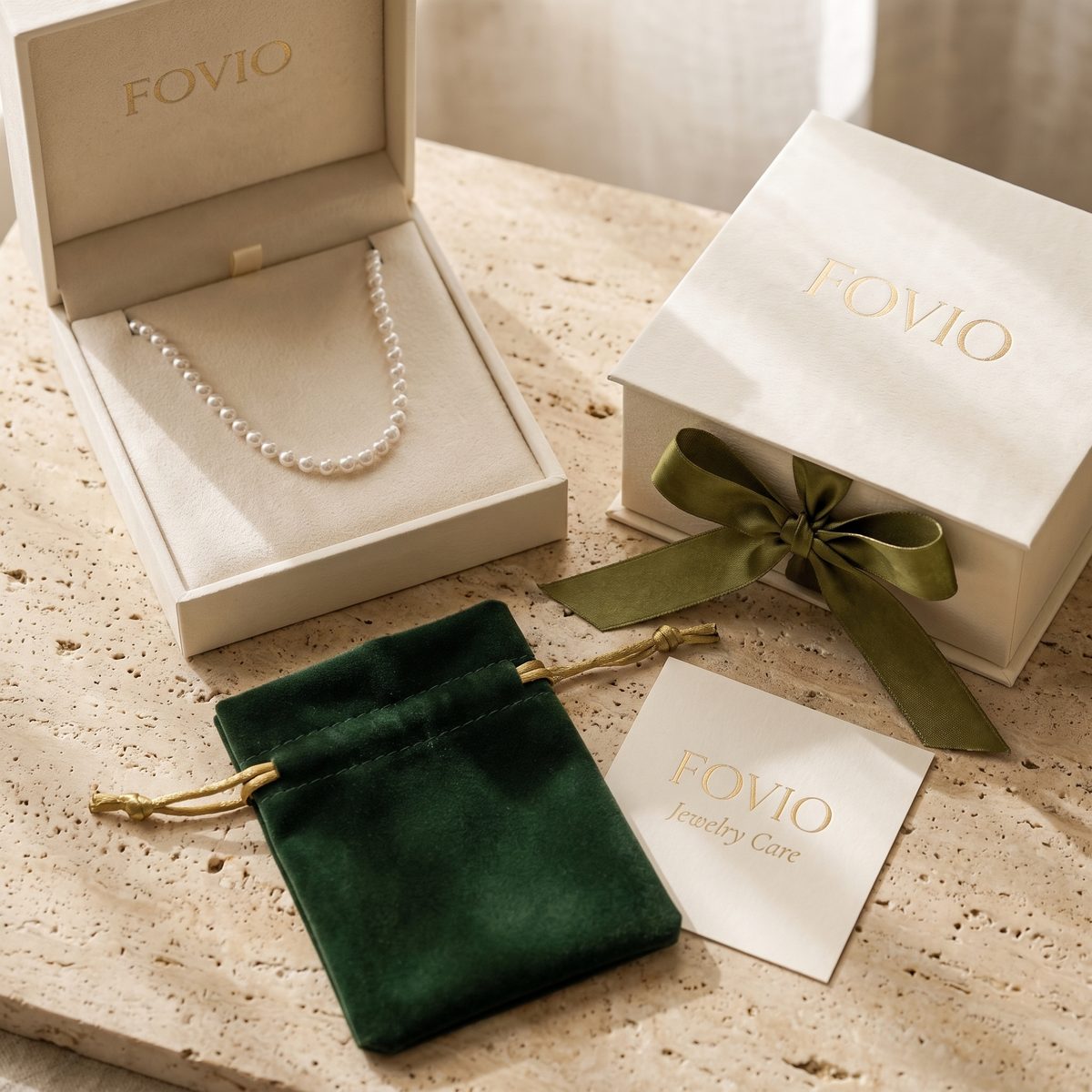 Complete FOVIO luxury jewelry unboxing suite flatlay arrangement